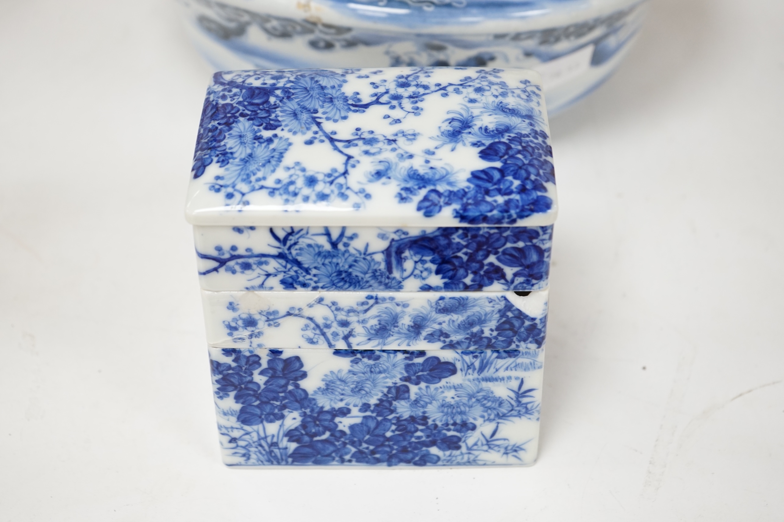 A Japanese blue and white Arita stacking box and bowl, 32cm diameter. Condition - bowl good, box poor